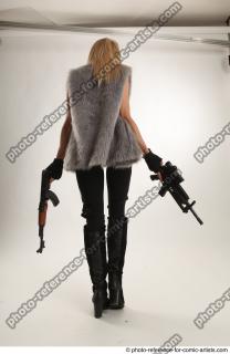 13 2018 01 NIKOL STANDING POSE WITH GUNS